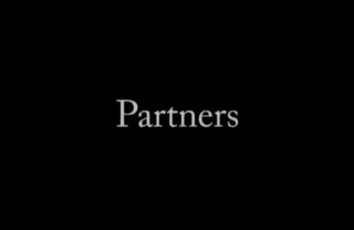 Black screen with white text that says "Partners"