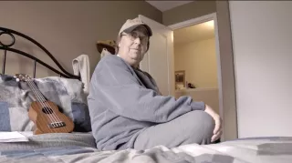 Man sitting on bed