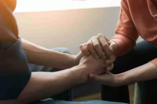 Holding hand for emotional support about dialysis