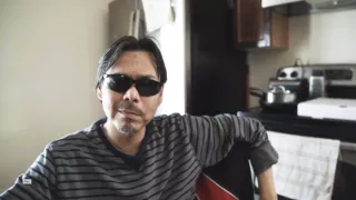 Man with sunglasses smiling
