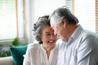 Elderly couple happily chatting